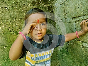 Kids are placing their hands on the walls, Itching in the eye. smaller girl nilam photo